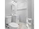 Cozy bathroom with a white vanity, toilet, and white hexagon tile flooring, offering a clean and simple design at 3104 Bay St, Sarasota, FL 34237