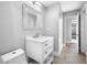 Bright bathroom featuring a white vanity with marble countertop, modern fixtures, and neutral color palette at 3104 Bay St, Sarasota, FL 34237