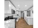 Modern kitchen featuring white cabinets, stainless appliances and a center island at 3104 Bay St, Sarasota, FL 34237