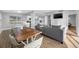 Spacious living area with an open floor plan, hardwood floors and seamless integration with kitchen at 3104 Bay St, Sarasota, FL 34237