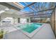 Inviting screened-in pool with ample patio space, ideal for outdoor entertaining and enjoying the Florida sunshine at 3104 Bay St, Sarasota, FL 34237