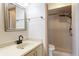 Bright bathroom with a beige vanity and walk-in shower featuring white tiling at 3416 Annette Ct # 71, Clearwater, FL 33761