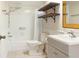Bathroom featuring a shower over tub with rustic shelves and a gray vanity with silver fixtures at 3416 Annette Ct # 71, Clearwater, FL 33761