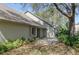 Side view of a well maintained single story home with light beige paint and a gray roof at 3416 Annette Ct # 71, Clearwater, FL 33761