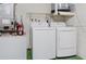 Bright laundry room with white LG washer and dryer and white walls at 3416 Annette Ct # 71, Clearwater, FL 33761
