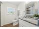 Bright bathroom with a vanity, granite countertop, and modern fixtures at 3600 Locust Ne St, St Petersburg, FL 33704