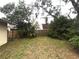 Spacious backyard featuring mature trees and a privacy fence, offering a serene outdoor space at 3608 Oak Bark Ln, Brandon, FL 33511