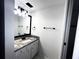 Bathroom features modern vanity, mirror, and updated fixtures at 3608 Oak Bark Ln, Brandon, FL 33511