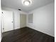 Bedroom with laminate flooring, closet, window and neutral paint at 3608 Oak Bark Ln, Brandon, FL 33511