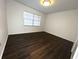 Bright bedroom with laminate flooring, window and neutral paint at 3608 Oak Bark Ln, Brandon, FL 33511