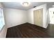 Bedroom with laminate flooring, window, closet and neutral paint at 3608 Oak Bark Ln, Brandon, FL 33511