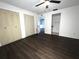Bedroom features a ceiling fan, closet, and vinyl floors at 3608 Oak Bark Ln, Brandon, FL 33511