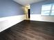 Large living room features new floors, neutral paint, and updated fixtures at 3608 Oak Bark Ln, Brandon, FL 33511