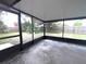 Large screened in patio with covered ceiling at 3608 Oak Bark Ln, Brandon, FL 33511