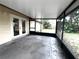 Screened in patio area with tile and view of fenced yard at 3608 Oak Bark Ln, Brandon, FL 33511