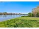 Lush green backyard featuring serene canal view and meticulously maintained landscaping at 370 Coffee Pot Riviera Ne, St Petersburg, FL 33704