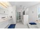 Bright, modern bathroom with walk-in glass shower, dual vessel sinks, and clean contemporary finishes at 375 Wellington Ave, Oldsmar, FL 34677