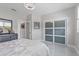 Bright bedroom with a sleek closet system, light-colored walls and floors, and contemporary decor at 375 Wellington Ave, Oldsmar, FL 34677