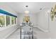 Contemporary dining room with modern lighting, stylish decor, and large windows offering natural light at 375 Wellington Ave, Oldsmar, FL 34677