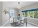 Bright dining room features large windows and a glass table perfect for enjoying meals at 375 Wellington Ave, Oldsmar, FL 34677