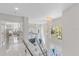 Bright foyer area with glass railings, high ceilings, and open floor plan, creating a grand entrance at 375 Wellington Ave, Oldsmar, FL 34677