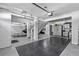Spacious garage with ample storage space, featuring a jet ski and organization units at 375 Wellington Ave, Oldsmar, FL 34677
