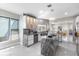 Bright, modern kitchen with white cabinets, a gray island, and stainless steel appliances at 375 Wellington Ave, Oldsmar, FL 34677
