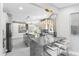 Elegant kitchen boasting marble island with seating, and stainless appliances at 375 Wellington Ave, Oldsmar, FL 34677
