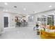 Open-concept living area with marble floors and stylish seating, seamlessly connected to the kitchen at 375 Wellington Ave, Oldsmar, FL 34677