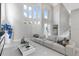 Bright living room with soaring ceilings, modern furniture, and plenty of natural light at 375 Wellington Ave, Oldsmar, FL 34677