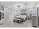 Primary suite with a fireplace, plantation shutters and tiled floors at 375 Wellington Ave, Oldsmar, FL 34677