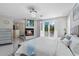 Spacious primary suite with a fireplace, ensuite bathroom and crystal chandelier at 375 Wellington Ave, Oldsmar, FL 34677