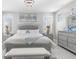 Beautiful primary suite with light paint, crystal chandelier, and luxury furniture at 375 Wellington Ave, Oldsmar, FL 34677