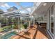 Beautiful patio with seating area that overlooks a pool and lush landscaping at 375 Wellington Ave, Oldsmar, FL 34677