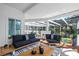Comfortable covered patio featuring plush seating and a view of lush greenery at 375 Wellington Ave, Oldsmar, FL 34677