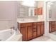 Luxurious bathroom showcasing a double vanity, soaking tub, and elegant finishes at 418 S Habana Ave, Tampa, FL 33609