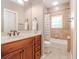 Cozy bathroom featuring a bath tub, a shower with curtain, and modern fixtures and towel hooks at 418 S Habana Ave, Tampa, FL 33609