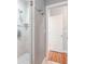 Clean bathroom featuring tile shower, a glass enclosure, and modern fixtures and towel hooks at 418 S Habana Ave, Tampa, FL 33609