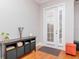 Inviting entryway with french doors, hardwood floors, and storage console at 418 S Habana Ave, Tampa, FL 33609
