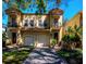Stunning two-story home featuring a two-car garage and beautiful paver driveway at 418 S Habana Ave, Tampa, FL 33609