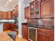 Luxury kitchen boasting a wine fridge, mosaic backsplash, and stainless steel appliances at 418 S Habana Ave, Tampa, FL 33609