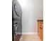 Convenient laundry room with modern washer and dryer, tiled floor, and cabinets at 418 S Habana Ave, Tampa, FL 33609