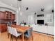 Open-concept living and dining area featuring a wooden table, modern decor, and bright ambiance at 418 S Habana Ave, Tampa, FL 33609