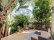 Lush backyard patio with outdoor seating, perfect for entertaining or relaxing at 418 S Habana Ave, Tampa, FL 33609