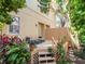 Beautiful backyard patio with outdoor seating and mature landscaping at 418 S Habana Ave, Tampa, FL 33609