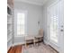 Cozy nook with natural light, featuring hardwood floors, a shuttered window, and a table and chairs at 418 S Habana Ave, Tampa, FL 33609