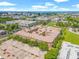 Stunning aerial view of the complex near downtown with lush green landscaping, parking and city views at 4221 W Spruce St # 1229, Tampa, FL 33607