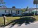 Charming one-story home with a well-maintained lawn and inviting curb appeal at 425 Highland Ct, Dunedin, FL 34698