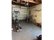 Spacious garage with storage and equipment for a home gym at 425 Highland Ct, Dunedin, FL 34698