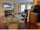 Open living area with a dining table, TV, and comfortable seating for entertaining guests at 425 Highland Ct, Dunedin, FL 34698
